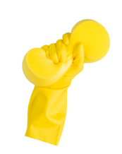 image of a hand wearing yellow glove and holding washcloth